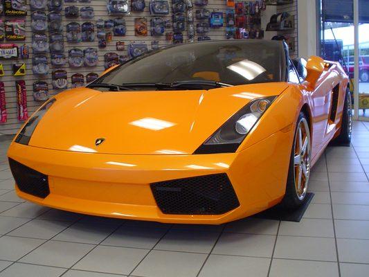 Custom lighting package on an Orange Ferrari.