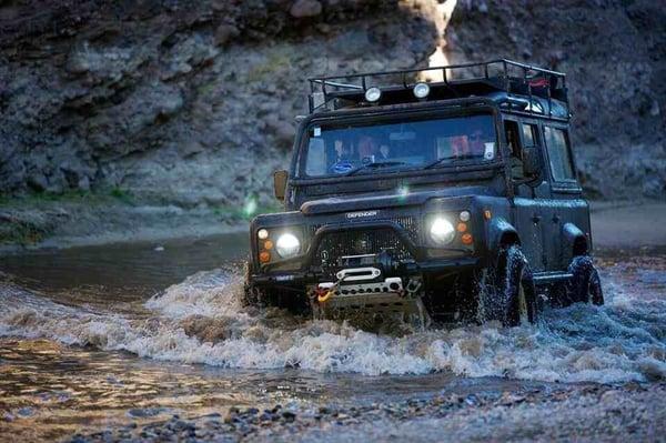 A nicely set up 93 Defender 110 with every mod available-doing a water crossing.This truck is on 35's with 4.75 gears,lockers and 4" lift.