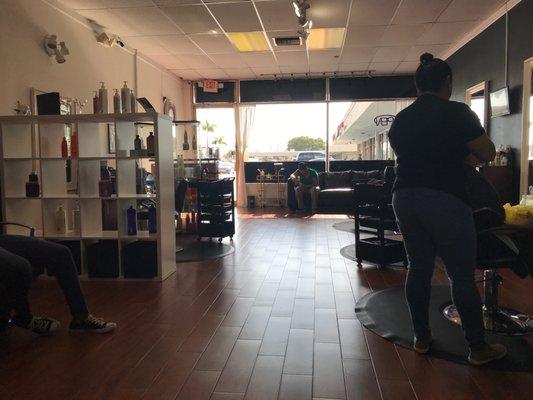 View sitting in the back under the hair dryer looking toward front of salon