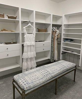 Walk-in closet with soft-close dovetailed wood drawers, shoe shelving and glide out hamper