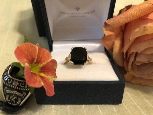 The stone from his class ring transformed into an engagement ring!