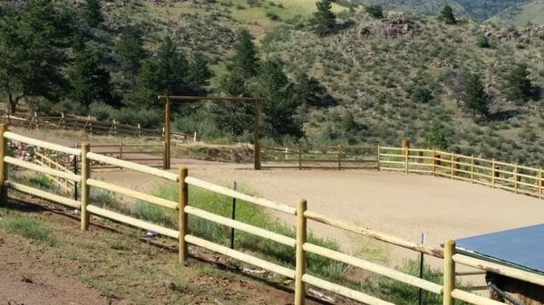 This picture shows buck and rail, peg and post, 4-rail arena fence, and an entrance we completed outside of Lyons, CO.