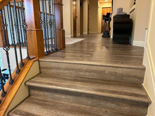 Luxury Vinyl Planks flooring installation and Cap-a-Tread installed on stairs