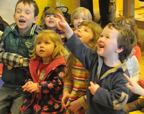 Kids having a blast at Franc Karpo's Preschool magic show.