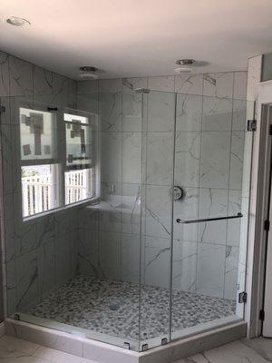 Custom angled frameless shower enclosure