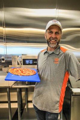 We make fresh pizzas and other hot meals daily at ZOOM