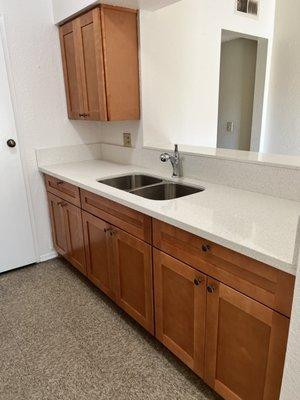 Maple shaker style cabinets + white crystal quartz countertop in West Covina.