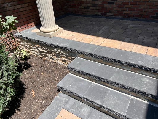 blacktop driveway with belgium block edge and Cambridge armortec paver apron and stoops with veneer stone facing