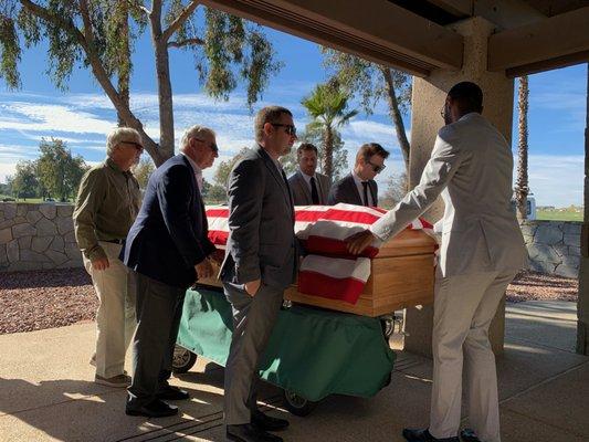 That's Freddie guiding the pall bearers ensuring that all went well.