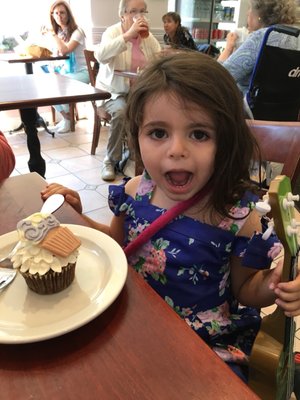 lol one enjoying chocolate ganache filled cupcake