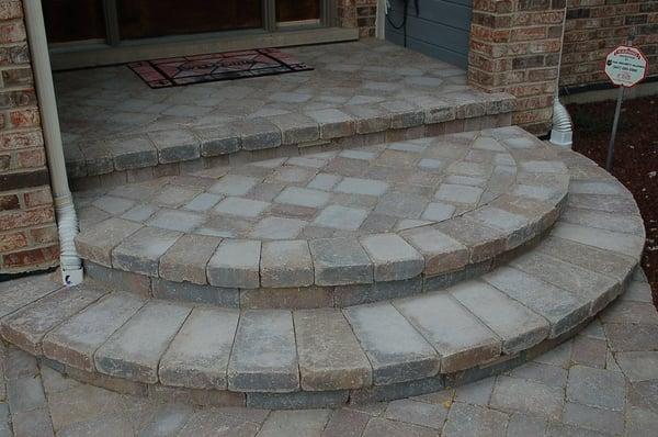 Front stoop constructed with brick pavers