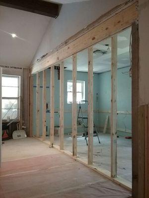 Load bearing wall removal. And Load Bearing beam has been installed. Now the temporary wall can be safely removed