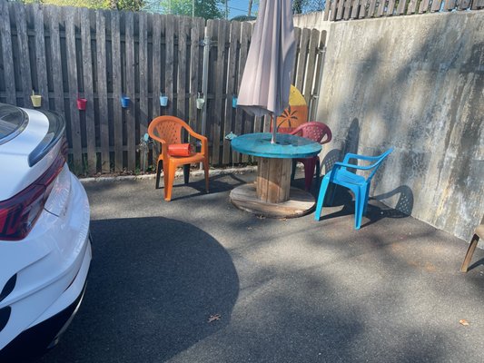 Tiki seating area in back parking lot