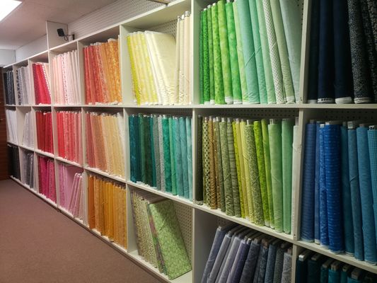 This is our color wall.  We stock 2000 to 3000 bolts of fabric.  We also carry 108" wide for backings.