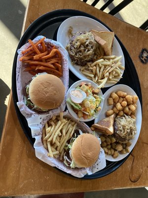 The horn, bacon cheeseburger, guacamole burger, salad and fried pickles.