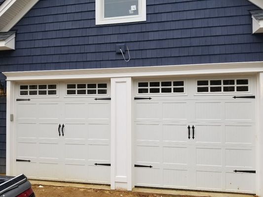 Custom Garage Door Center post and azak trim (maintenance free) installed in Smithtown. Giving your home a custom look.