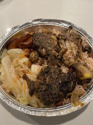 Large Jerk to go. Chicken nearly fall off bone. Spicy is right, I get oxtail gravy on top with extra jerk and scotch Binet on the side.