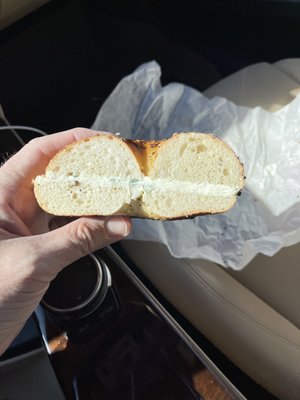 Pics of bagel and lack of cream cheese. Pics of closed and bagel opened up to show the real lack of cream cheese.