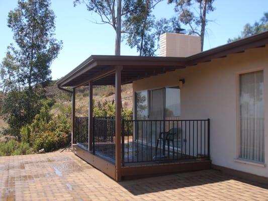 A nice shady space. Your new deck with a solid roof to protect you and the deck itself.