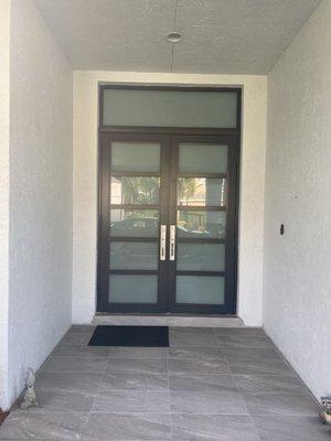 Impact rated door with transom