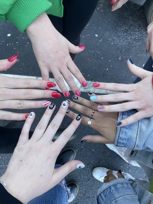 Four gel manicures and one acrylic (the red candy stripe)