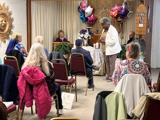 Rev. Bettye shares messages from spirit during the Message Service.