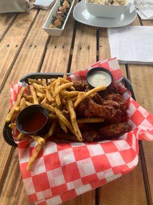 Honey lemon pepper wings with fries.