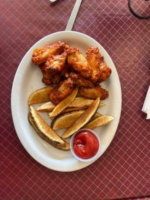 Wing plate with potato wedges - yum! The wings are so good and super spicy if you like things spicy. Habanero sauce