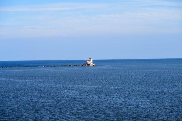 The 1934 Harbor West Pierhead Lighthouse visible offshore