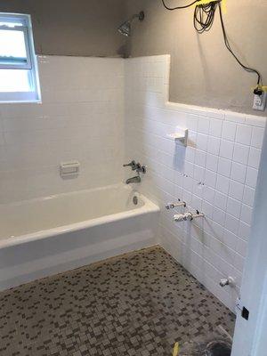 After refinishing tub and tile in white.