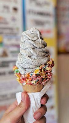 Black Sesame Soft Serve in Fruity Pebbles waffle cone