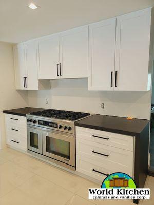 White kitchen with a black countertop