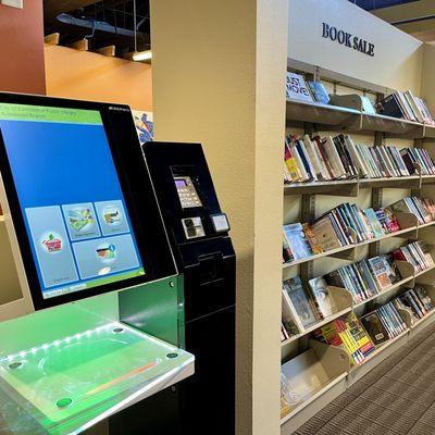 Self Check-Out with tap to pay, and Used Book Sale.