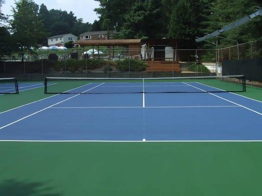 Refurbished, lighted tennis courts.