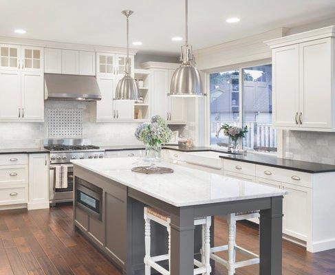 White shaker kitchen with stacked clear glass cabinets- Antique tin grey island