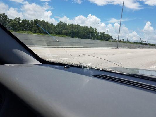 Our windshield after he didn't want to pull over to trade insurance information... The owner is the drive!