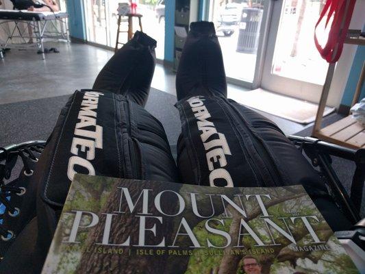 Reading magazines while my legs are getting massaged and compressed in the Normatec Recovery Boots.