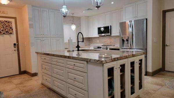 New cabinets, quartzite countertops and porcelain tile backsplash... loving my new kitchen!