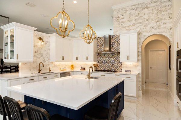 White Shaker Kitchen Cabinets with a beautiful all white Quartz countertop finished with some Gold handles !!!!