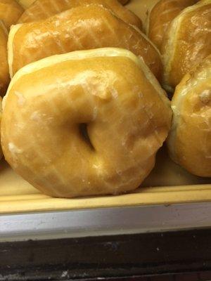 A tasty traditional glazed donut!