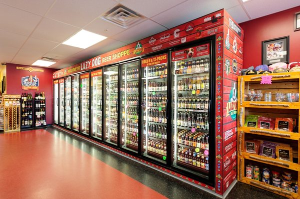 13 cooler doors filled with singles to make your mixed 6 packs