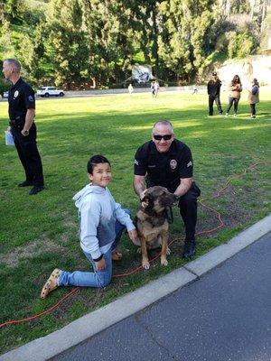 My grandson & a K9 dog & Officer