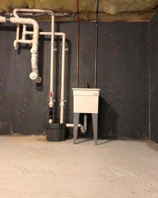 Installation of new utility sink and installation of new sewer ejector pump