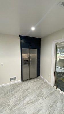 Recessed fridge, built ins cabinets.