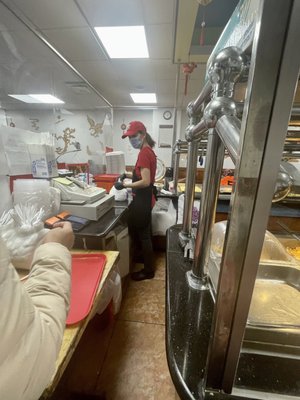 Staff by the counter. Come here, pay then get a box