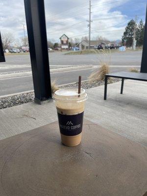 Iced vanilla chai made with coconut milk.  Sofa king good.