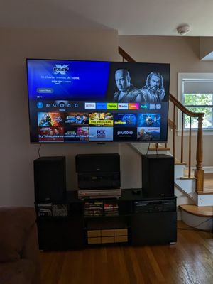 65" TV mounted in living room.