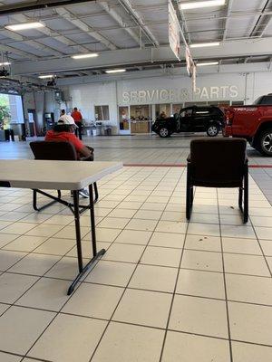 Social distanced waiting area outside. Masks required at dealership. They cover the driver seat with plastic.