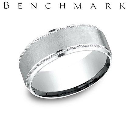 We carry Benchmark, a leader in men's wedding bands.