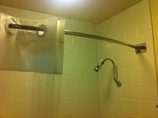 Nice bathrooms, with curved shower rod (see our hint about using the shower)